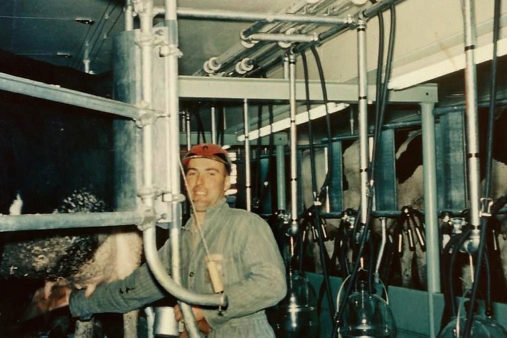 George in the milk parlor at the farm