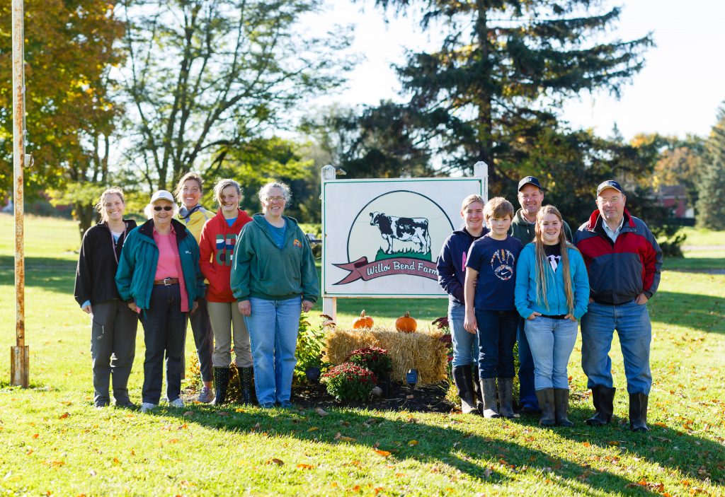 Group picture next to the farm sign